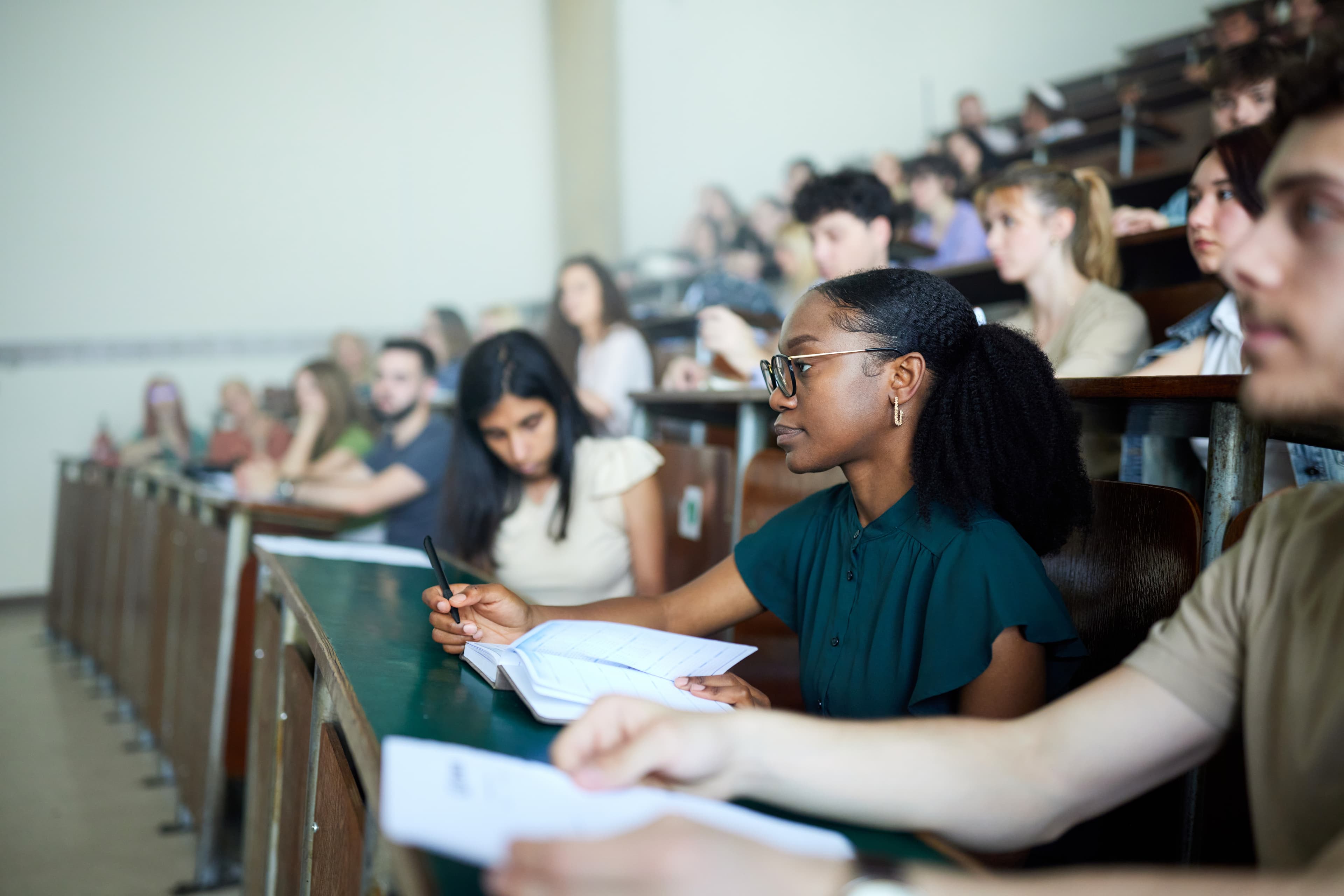 Law student following a guided course in a classroom