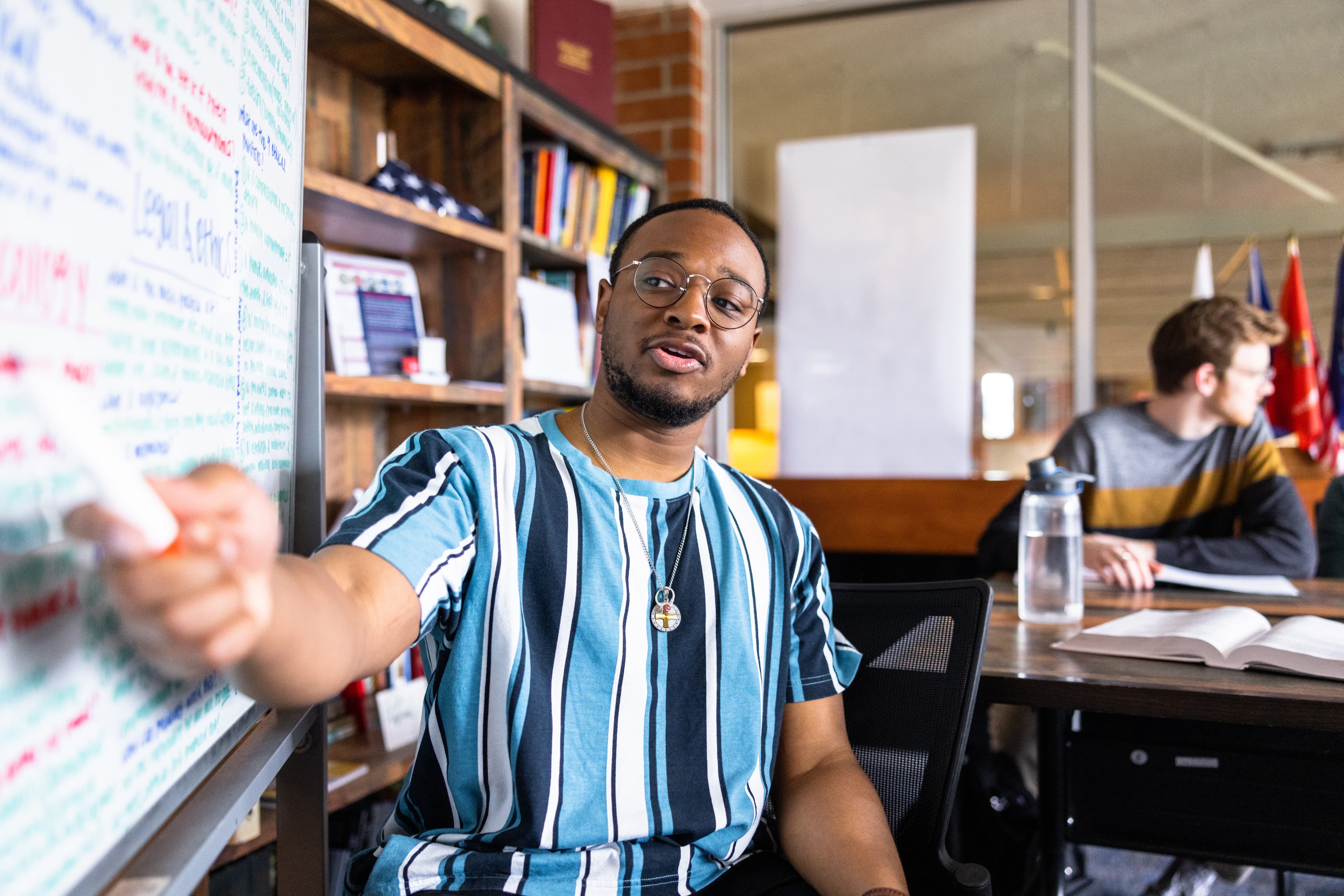 Student explaining a legal concept in a study room